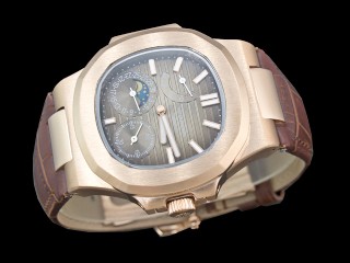 patek philippe nautilus date moonphase power reserve hand wound man watch