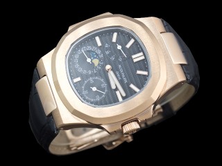 patek philippe nautilus date moonphase power reserve hand wound man watch
